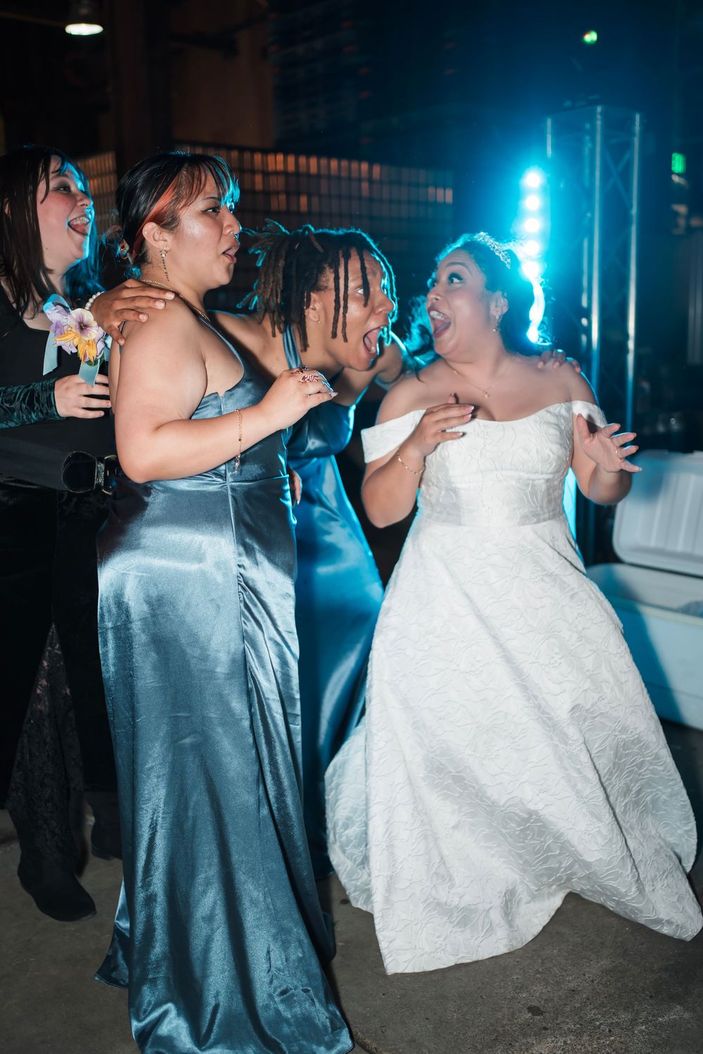 The wife dances with her bridesmaids on the dancefloor in alameda county