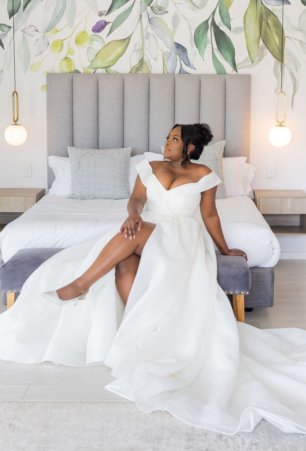 Elegant white wedding gown with off-shoulder neckline and full skirt photographed in various artistic angles against grey decor.