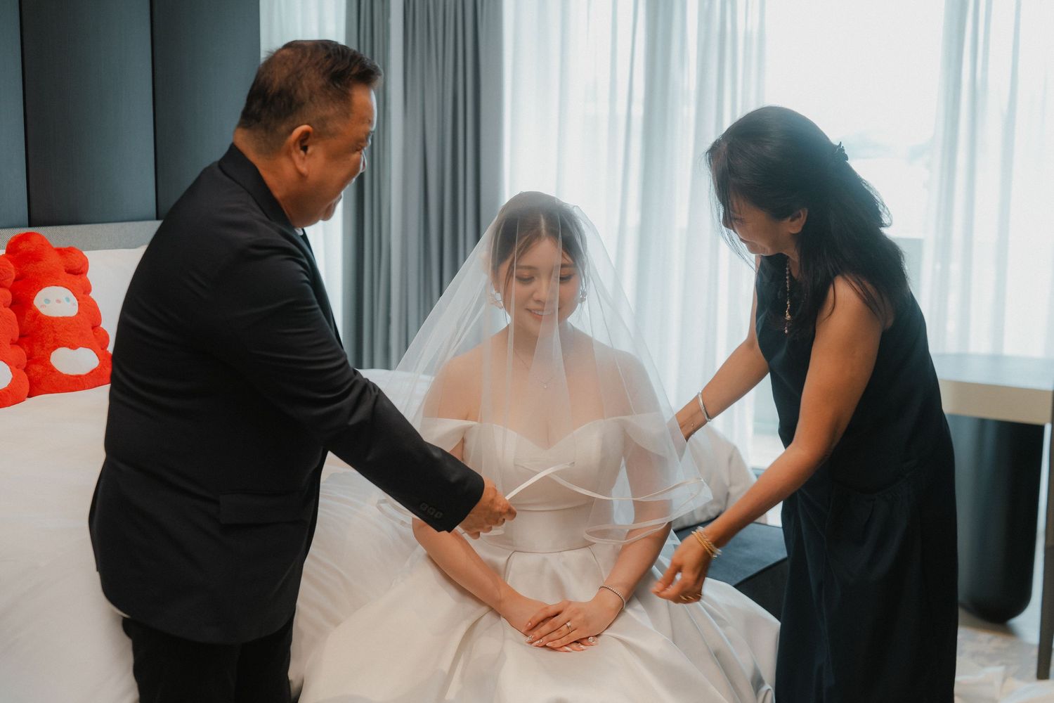 Traditional Chinese wedding tea ceremony with guests gathered in formal attire.