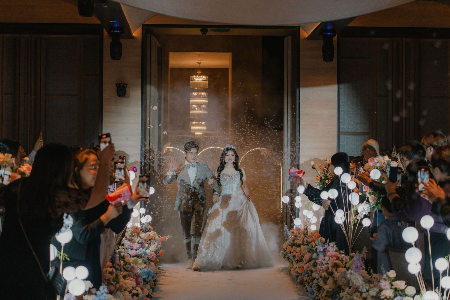 Romantic wedding ceremony setup with floral decorations and warm ambient lighting.