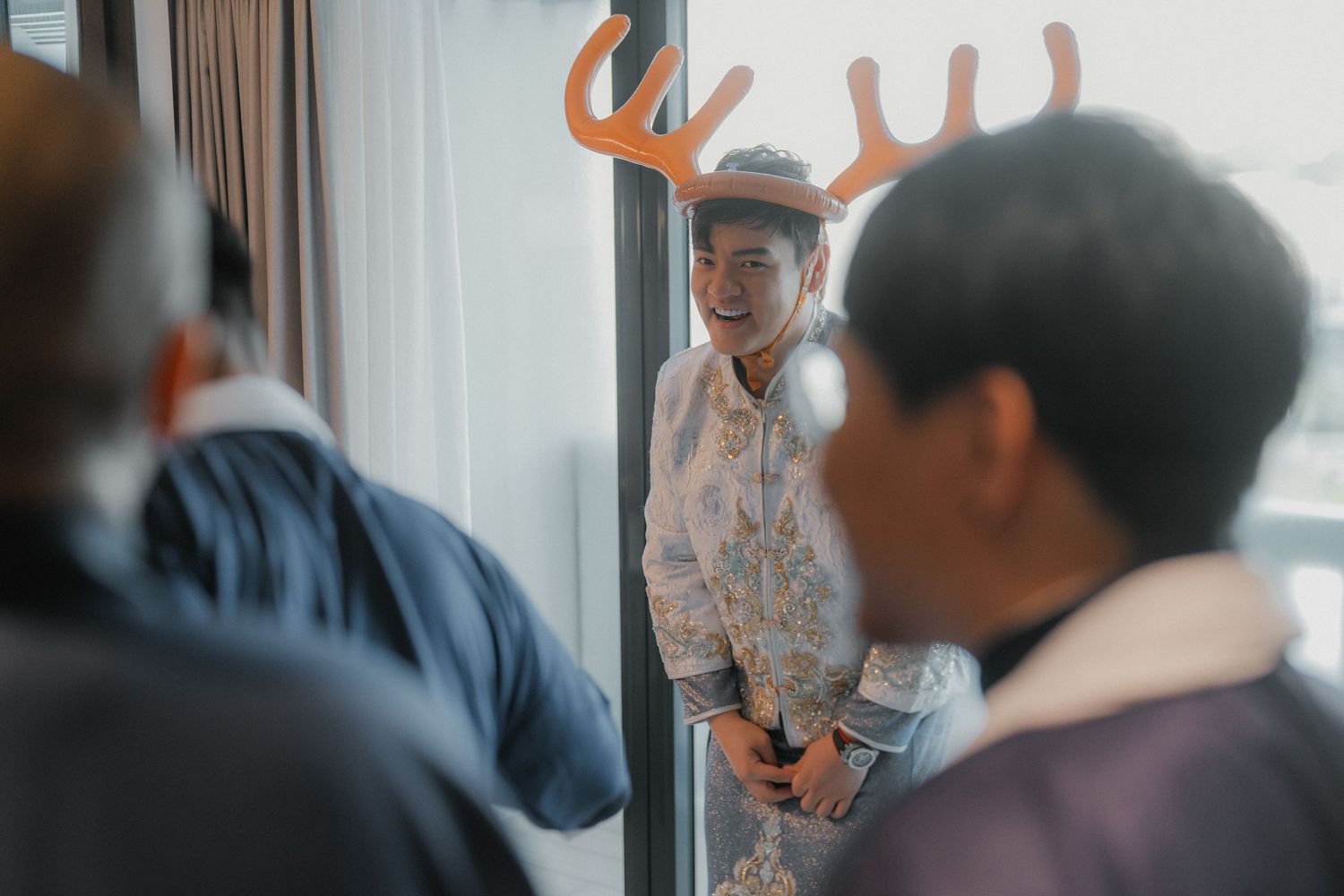 Wedding celebration with guests playing interactive games in a modern venue.