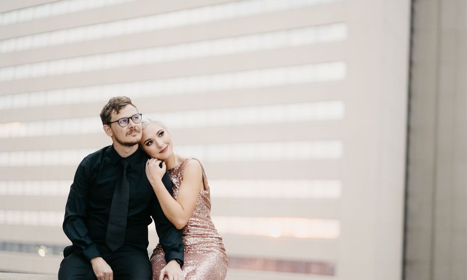 Timeless and romantic couple looking in love in the city for their engagement shoot at Sandton City Rooftop in South Africa