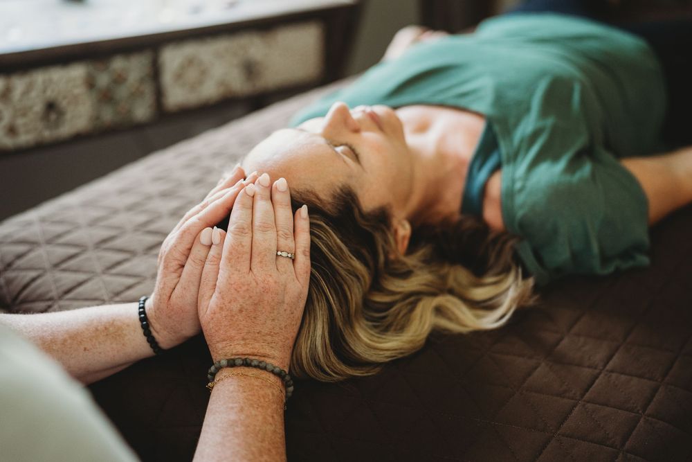 A person receives a relaxing facial massage treatment at a luxury spa.