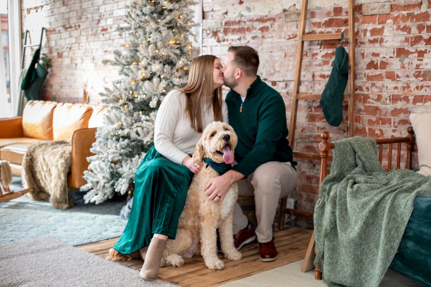 Twin pregnancy announcement Christmas photos in Cincinnati featuring dog, holiday setup, and joyful expecting family lifestyle photography