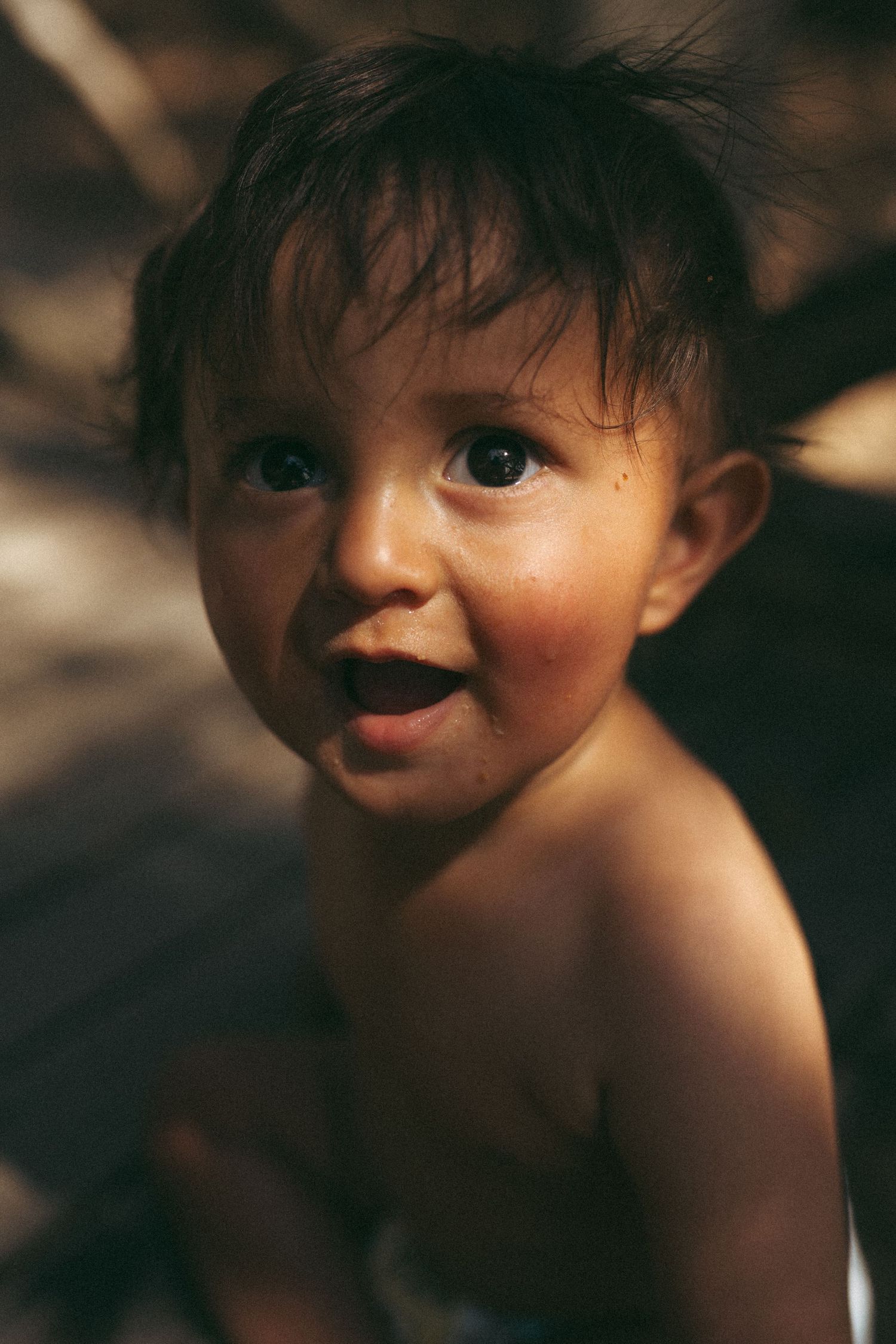 Close-up portrait of child with playful expression.