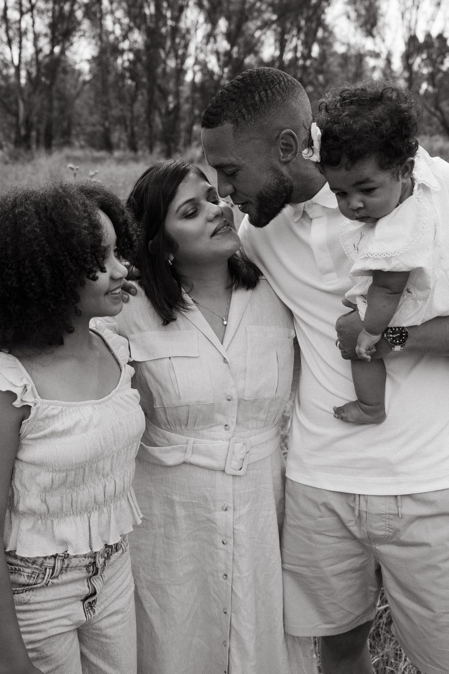 Series of candid moments showing a family interacting playfully in an outdoor setting.
