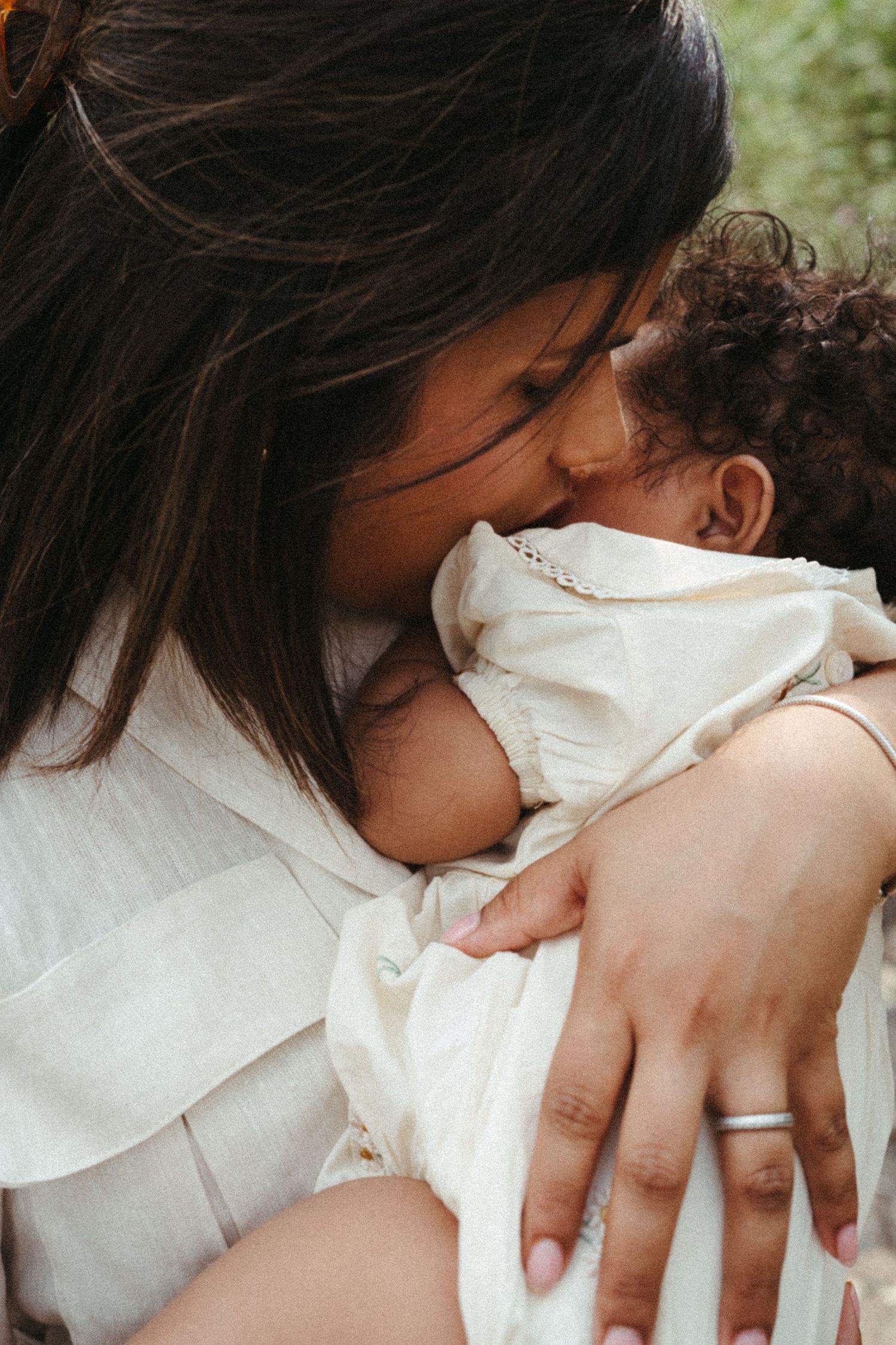 Close-up photos showing affectionate embraces while wearing white clothing.