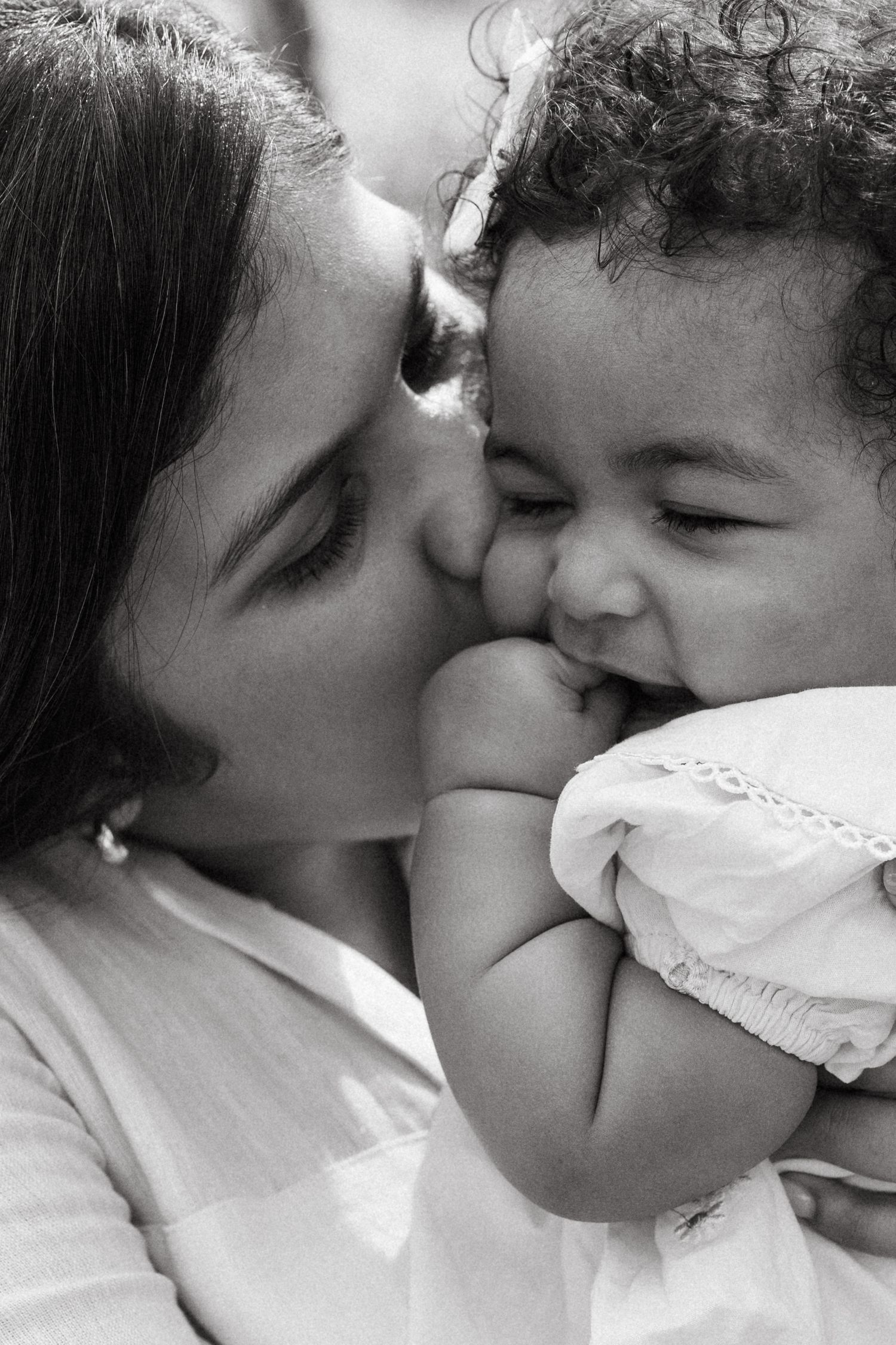 Black and white photo sequence capturing intimate moments between two people.