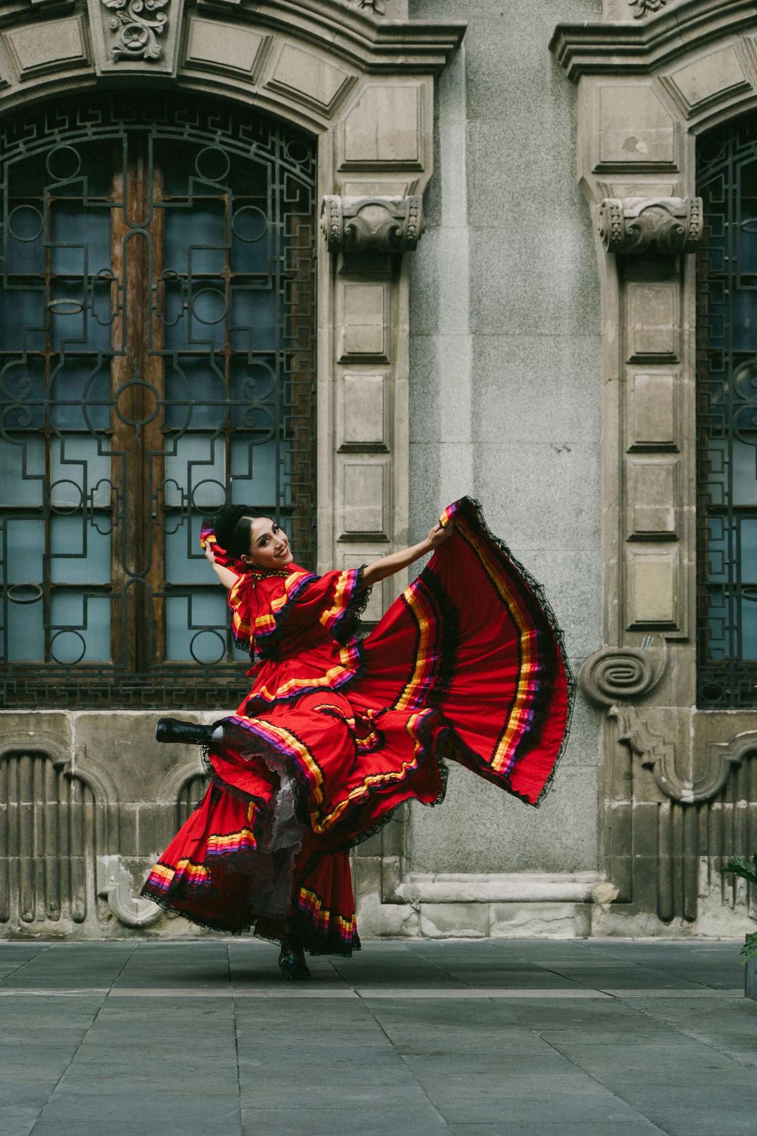 Ballet Folklórico de México dancer posing in traditional costume in downtown Mexico City