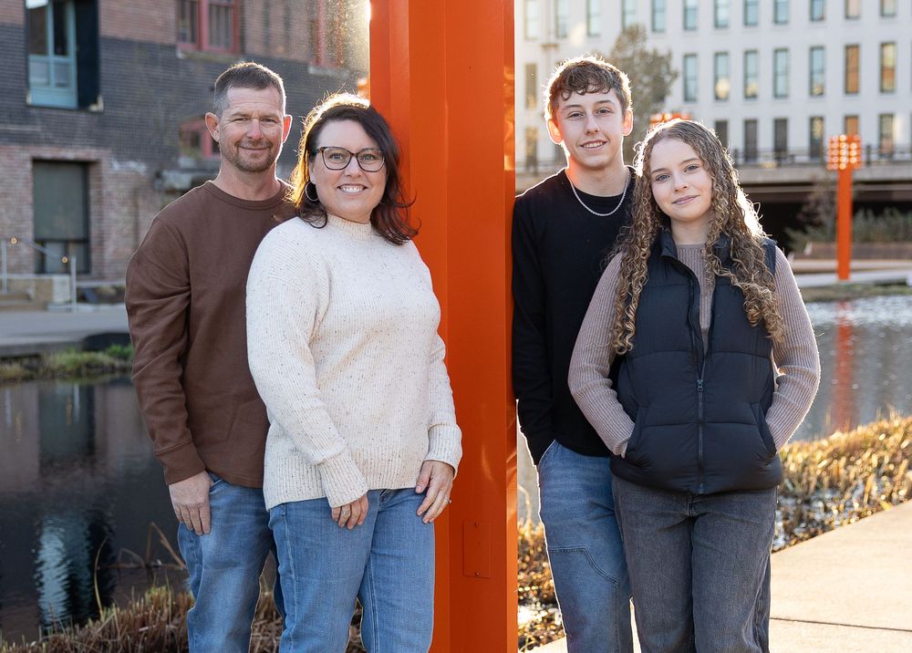 Family session in downtown Omaha along the Gene Leahy Mall Riverfront.