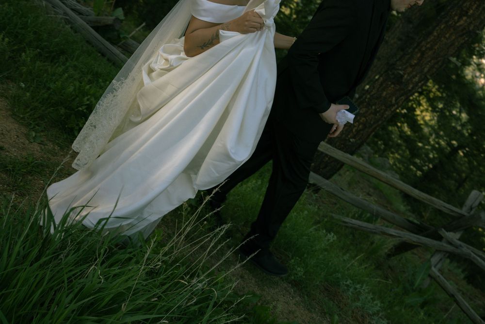 Couple walking together during post-ceremony wedding portraits in Boulder, Colorado.