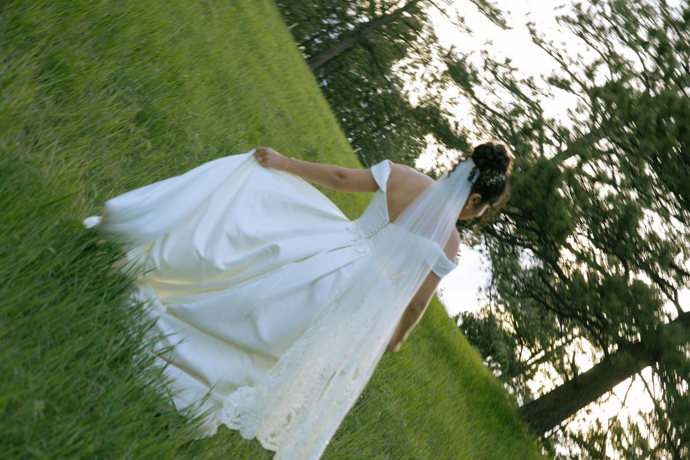 Solo bride twirling among trees in the Boulder mountains during wedding portraits.