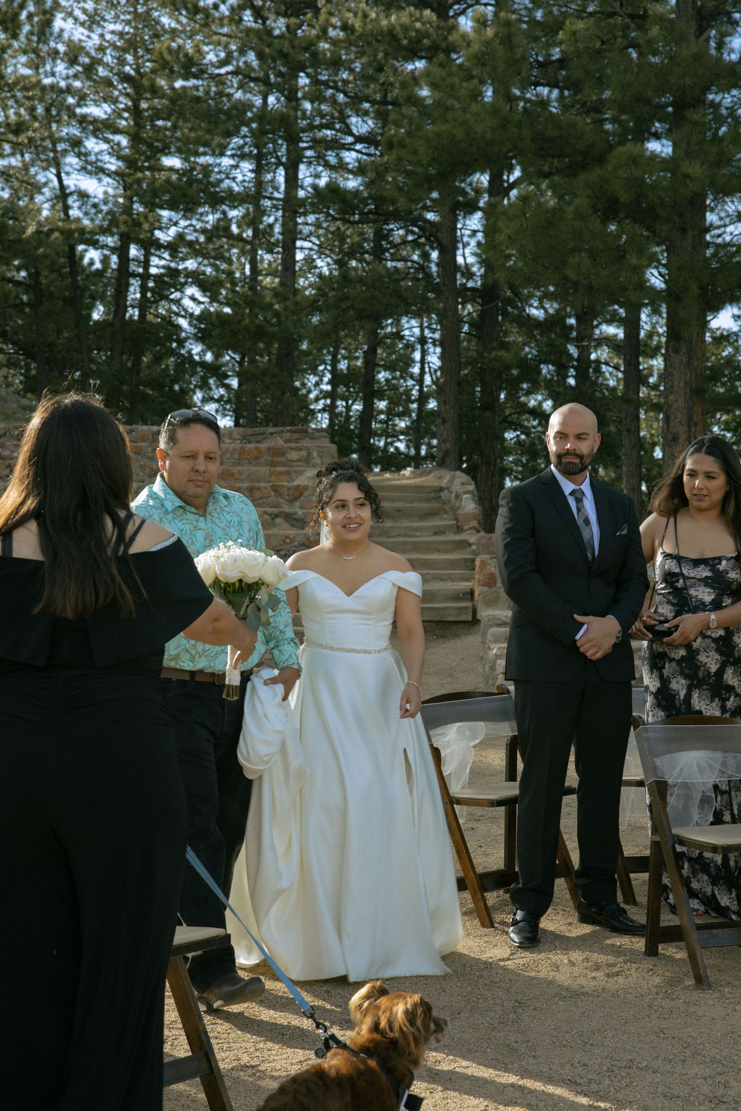 Bride entering her wedding ceremony at Sunrise Amphitheater in Boulder at sunrise.