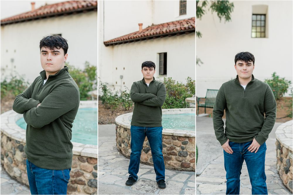 mission prep senior photos | senior guy wearing dark green quarter zip sweater for senior photos standing by downtown slo mission fountain