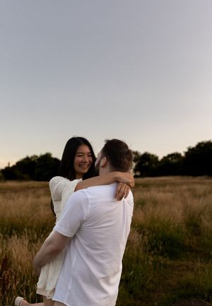 photograph of a couple in a golden field.