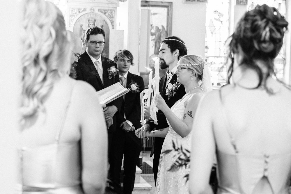 Black and white photo collage showing candid moments at an elegant wedding reception.