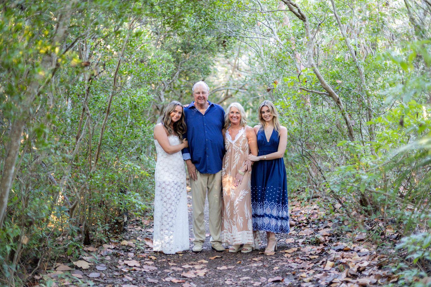 Family photoshoot picture in Fort Lauderdale Florida, in a wooded trail, taken by Wanderlust Studios