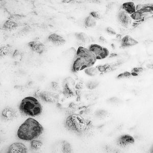 foam and pebbles in the sun durham heritage coast