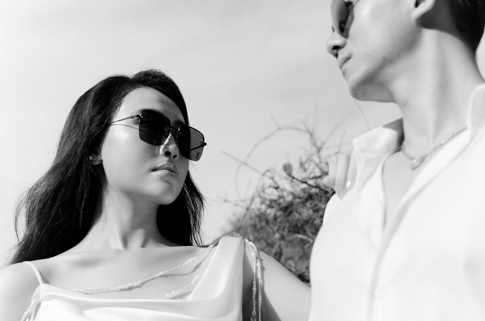 A series of black and white romantic artistic couple portraits showing affection and intimate moments.