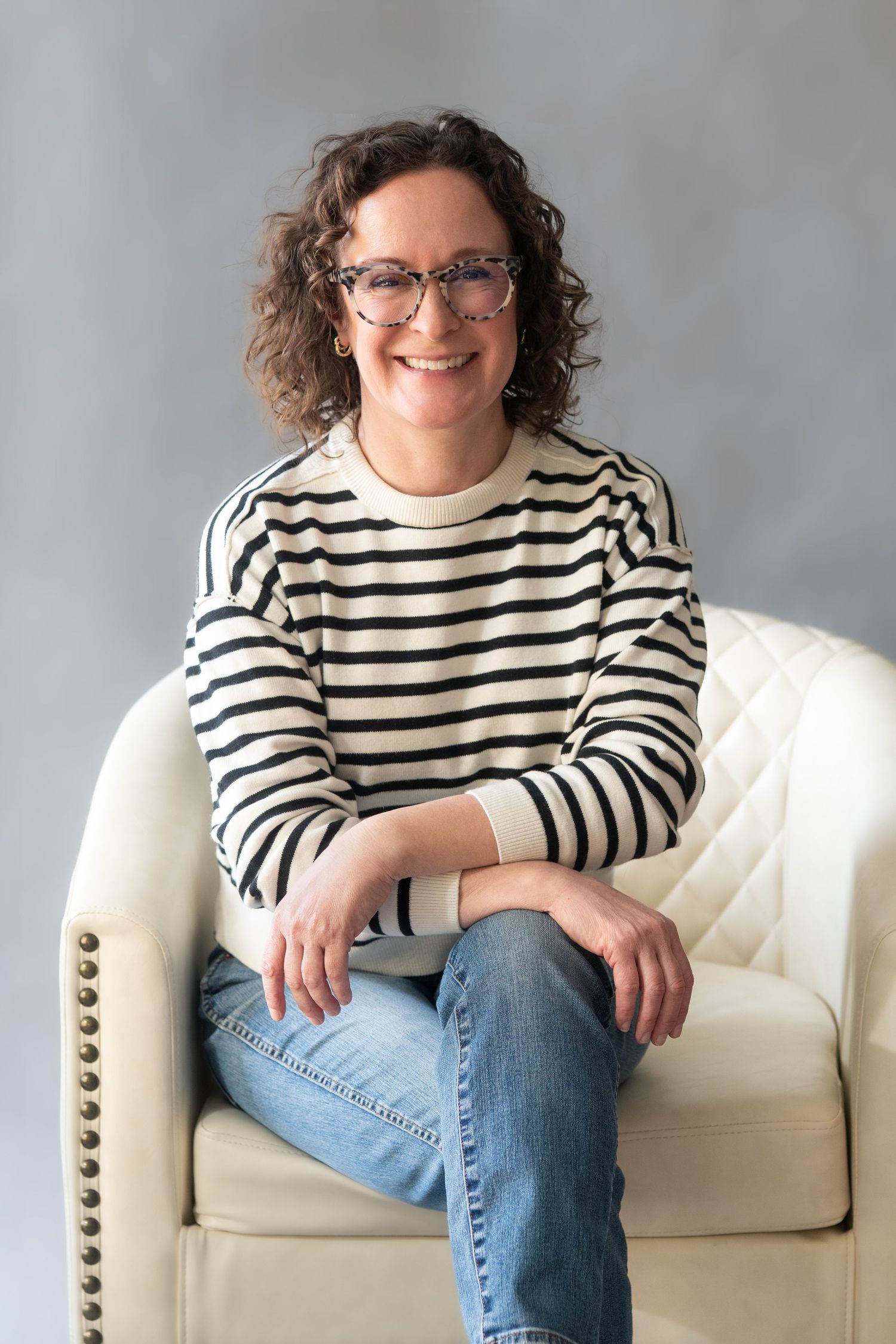 Professional headshot of a woman seated in Columbus, Ohio, photographed by Jamie Macey Photography