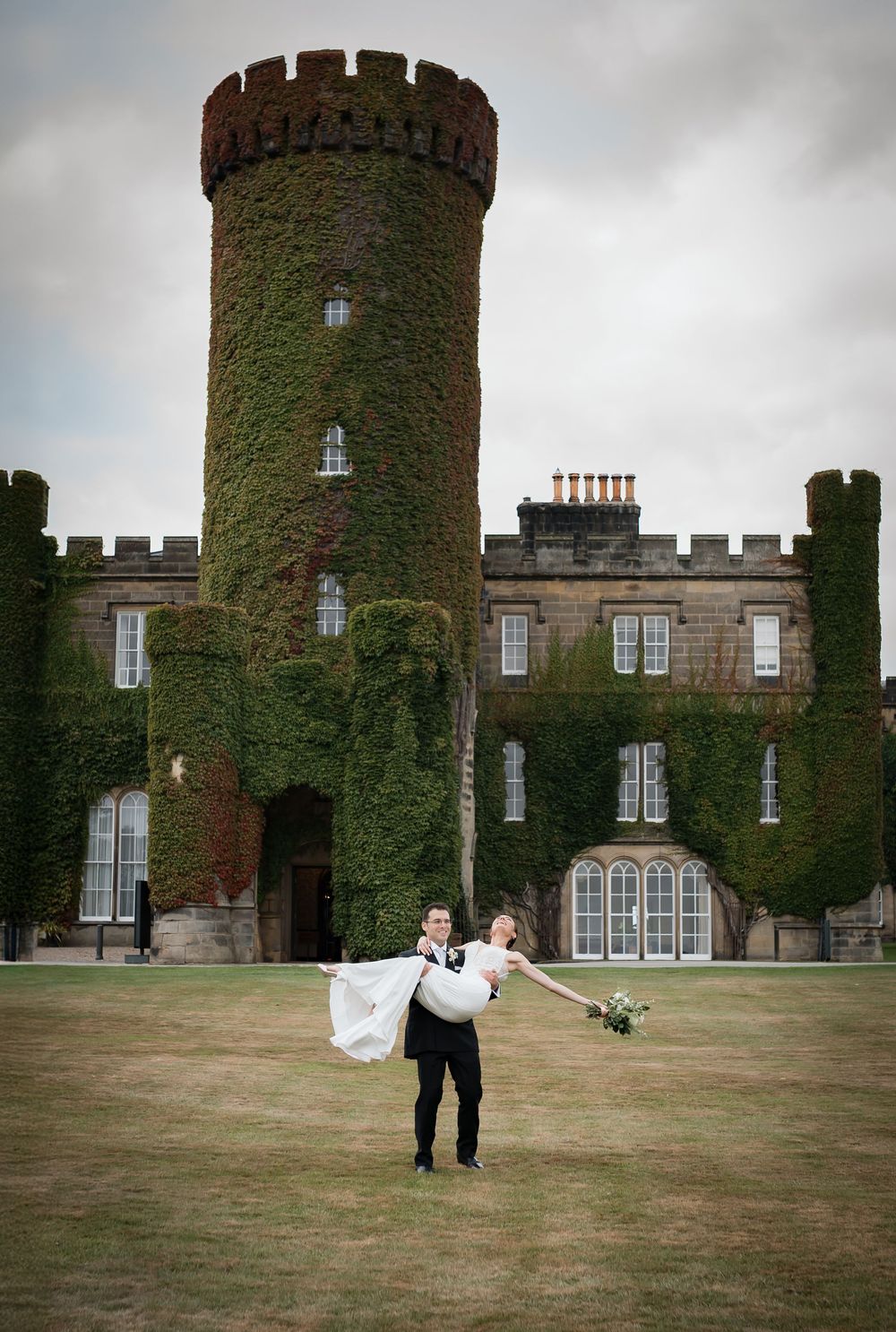 A romantic wedding photo sequence showing a couple dancing and spinning on the lawn of an ivy-covered castle.