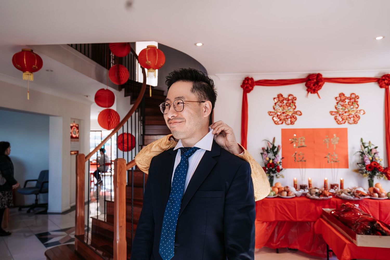 Festive Chinese New Year decorations with red lanterns and wall ornaments in a modern interior.
