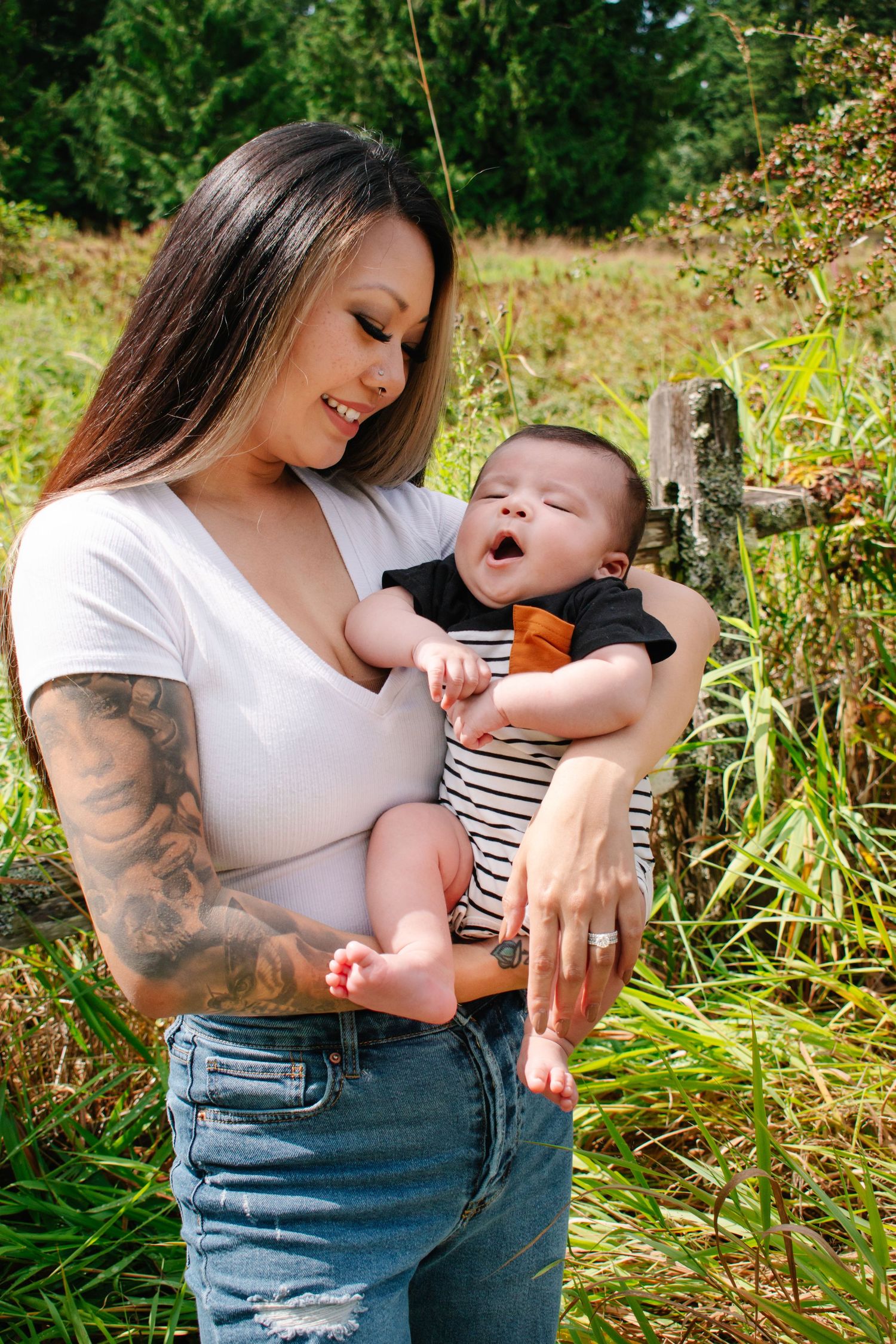 Mother holding baby during fall family photo session in Seattle
