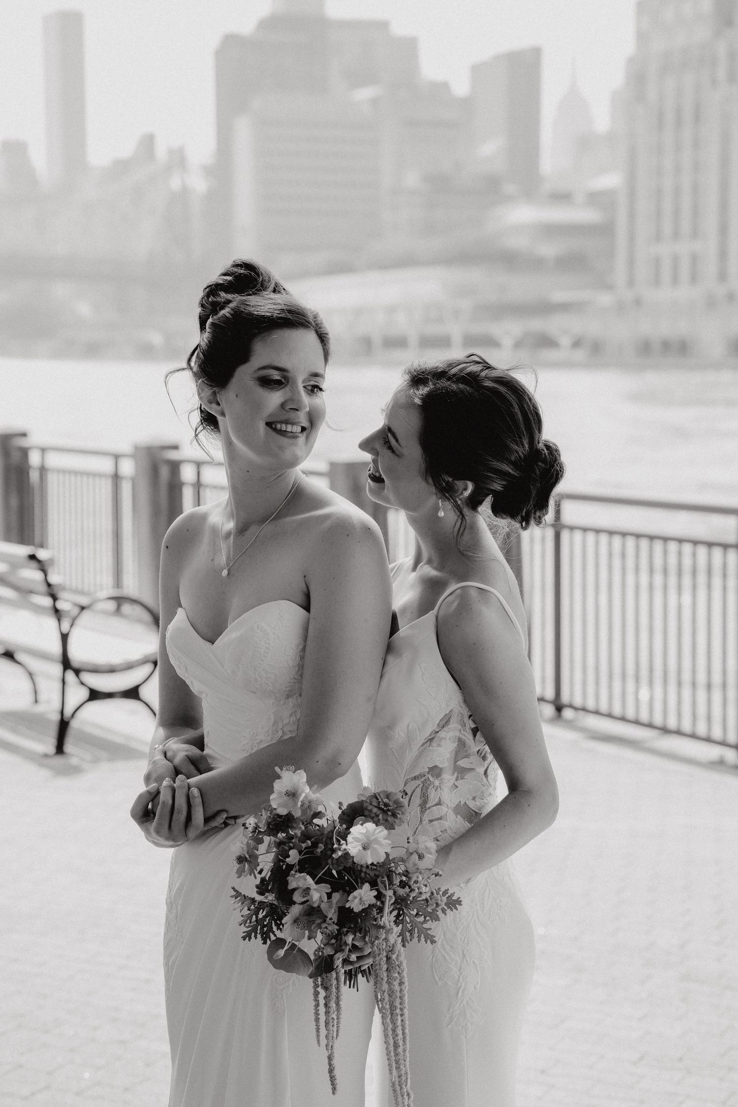 Black and white photo sequence of bridesmaids in white dresses sharing joyful moments at the Sanctuary Roosevelt Island NYC
