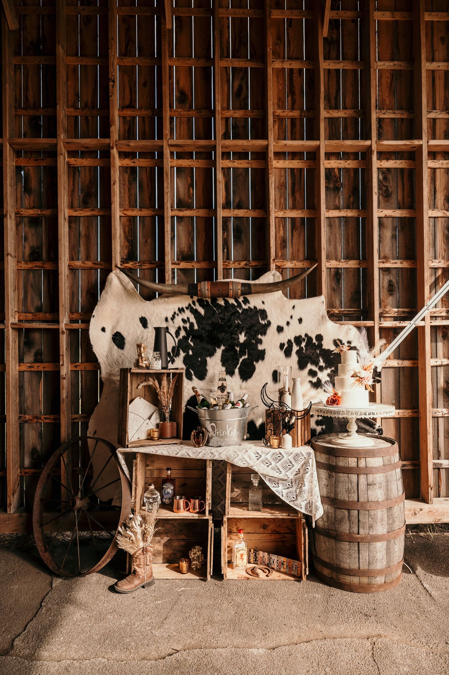 Three rustic interior scenes of a vintage barn or workshop with wooden barrels, tools, and antique equipment against slatted walls.