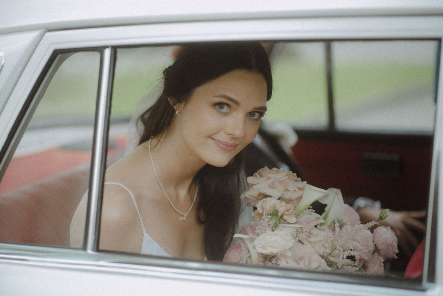 Elegant wedding transportation featuring classic car interior details.