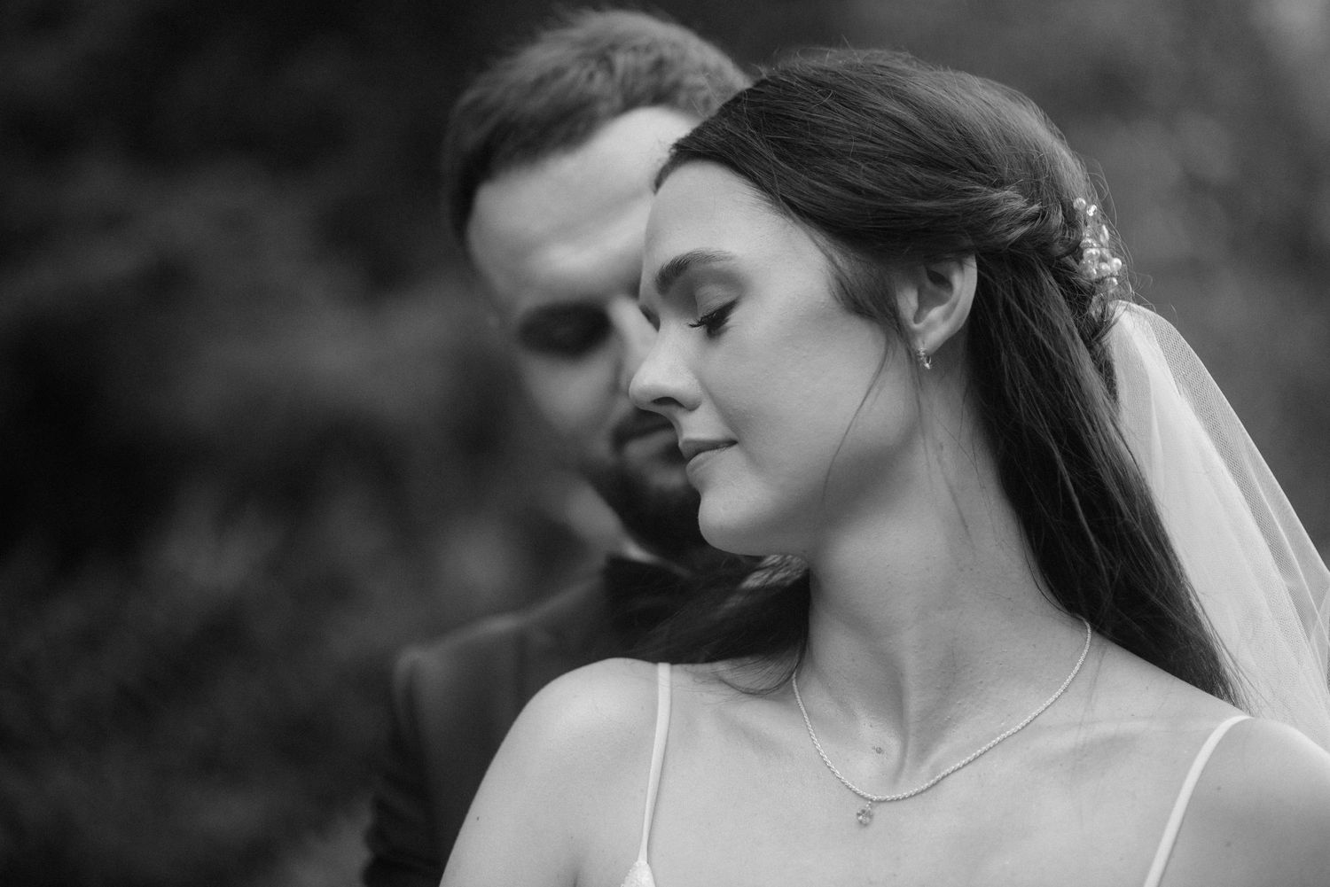 Long veil flowing in the wind during outdoor bridal portrait session.