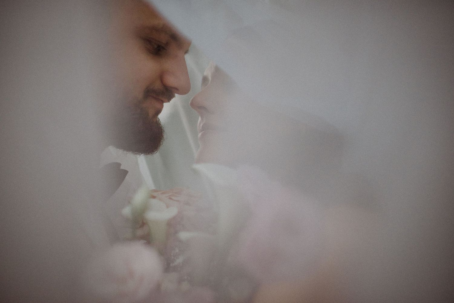 Intimate close-up of a couple sharing a tender moment through soft focus.