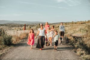 Group walking together on a scenic desert trail during golden hour.