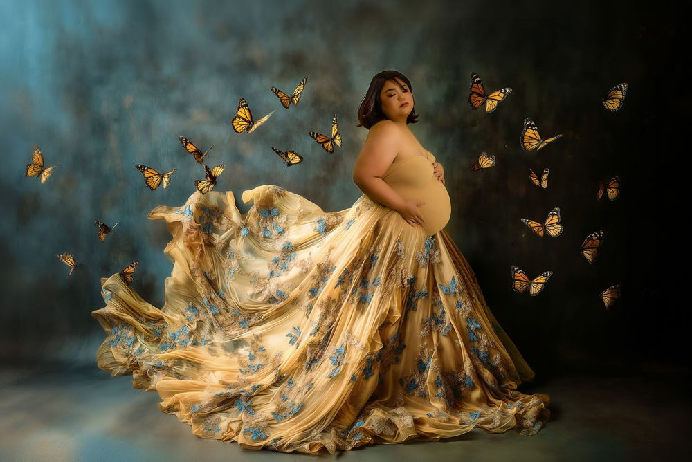 A figure in a flowing gold dress poses gracefully among fluttering monarch butterflies in a moody dark setting.