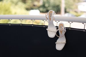 A series of white spot lights mounted on dark ceiling tracks create dramatic lighting effects.