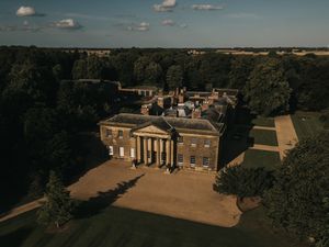 Aerial views of Rise Hall with columned portico and expansive grounds. Image taken by Grimsby photographers.