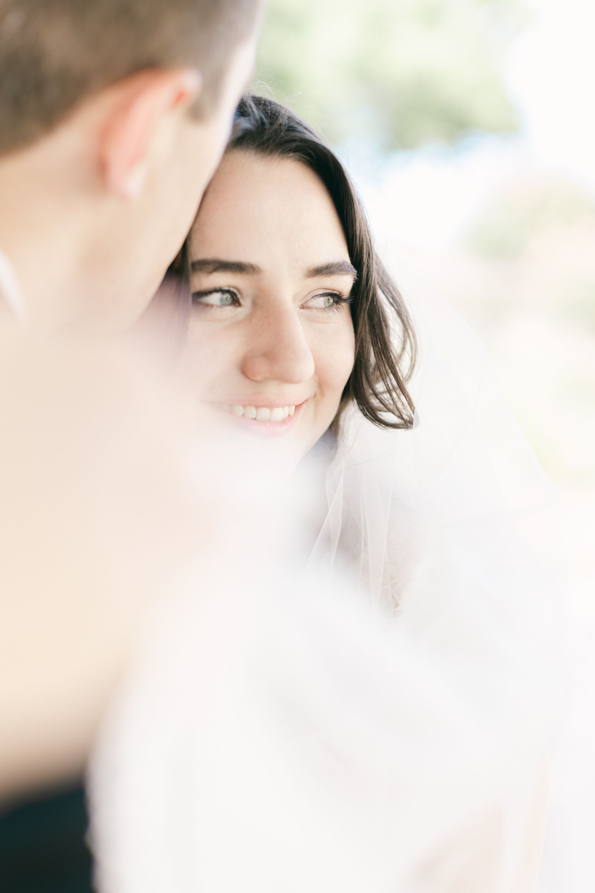 Soft focus romantic wedding portrait with natural lighting.