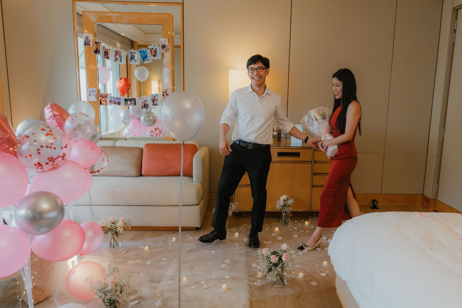 Timelapse sequence showing people playing with bubble machines and party decorations in a brightly lit indoor room.
