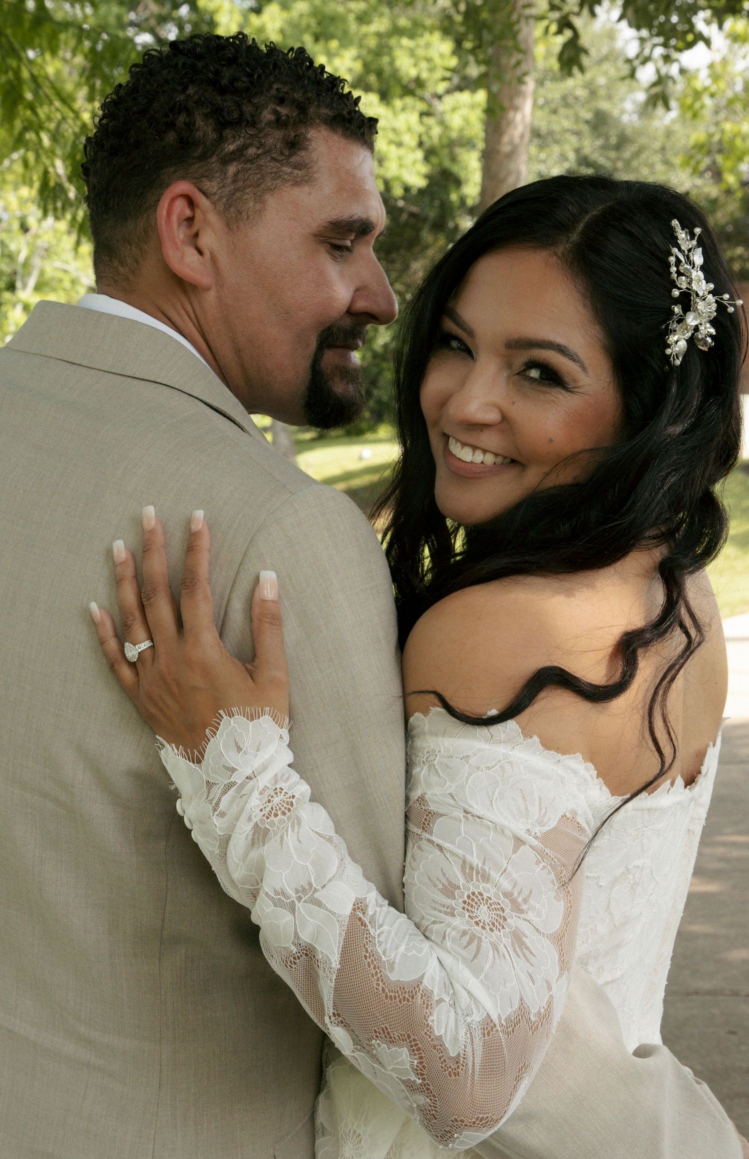 Close-up sequence captures tender romantic moments between newlyweds, with bride in elegant white lace gown during outdoor wedding photos.