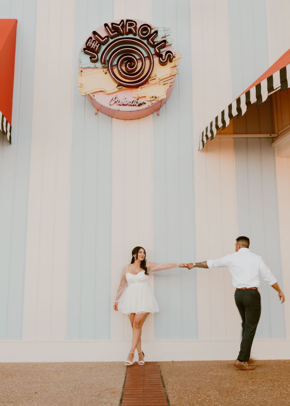 Bride & Groom eloping at Disney Boardwalk. Cred: LexTakePix