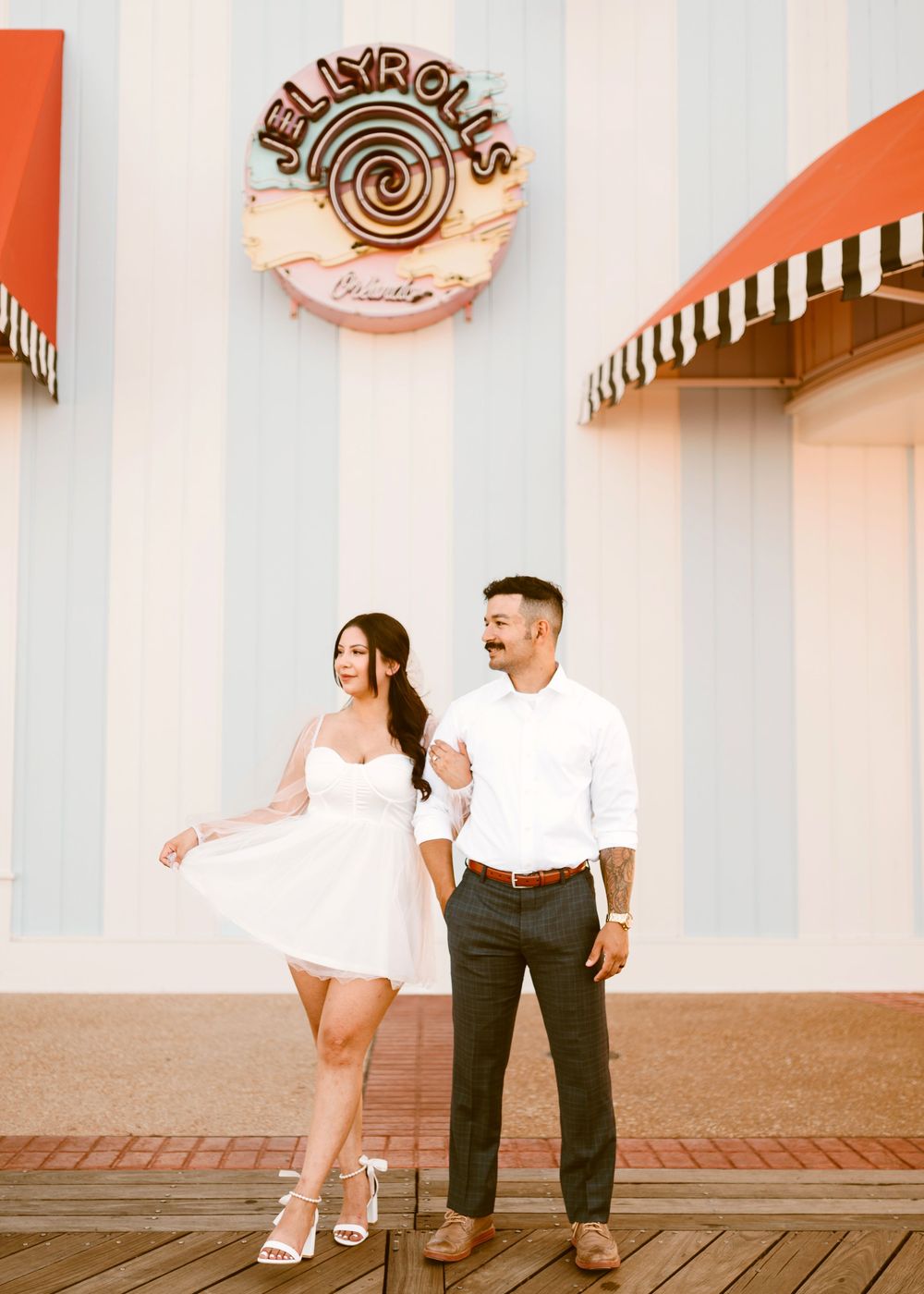 Bride & Groom eloping at Disney Boardwalk. Cred: LexTakePix