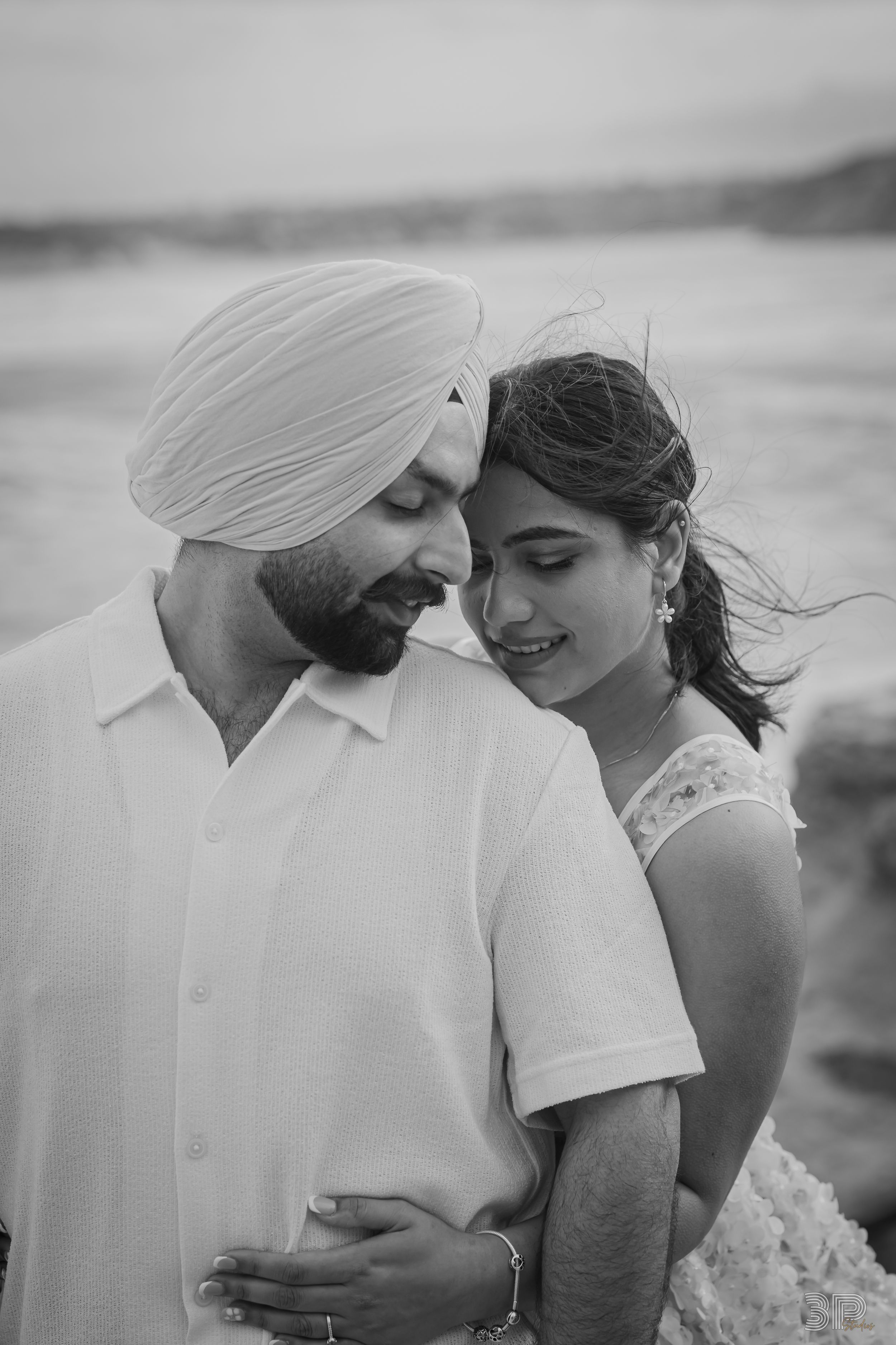 Black and white romantic couple photos showing tender moments and embraces in a series of intimate portraits.