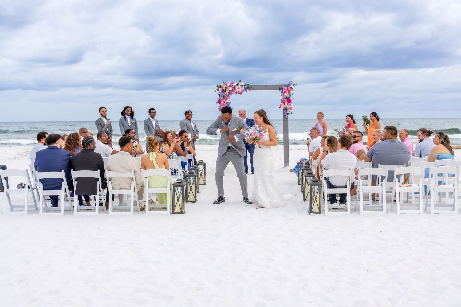 A panoramic collage of a beach wedding ceremony with white chairs set up on the sand under cloudy skies.