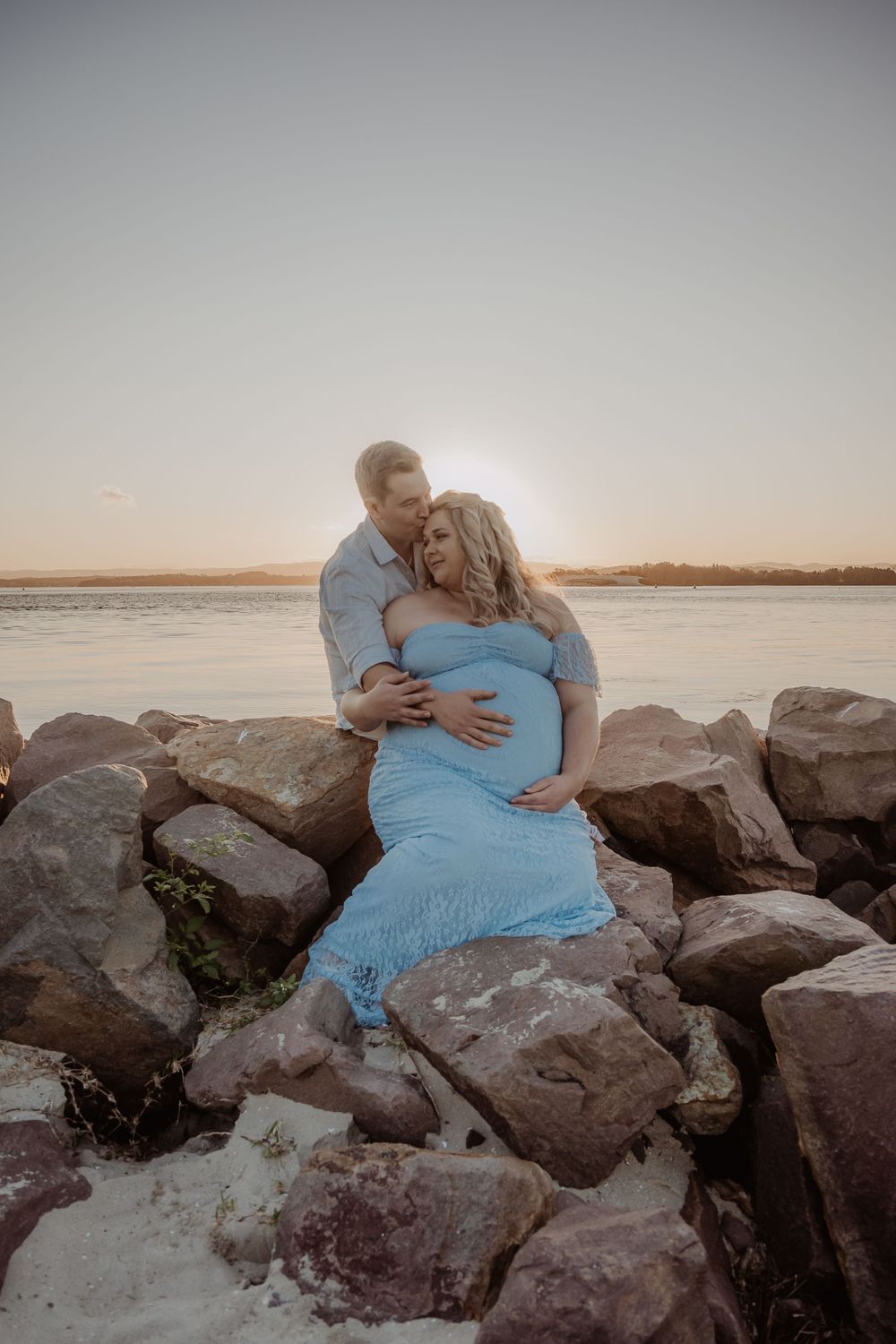 Sunset central coast maternity photoshoot on rocky coastal outcrop.