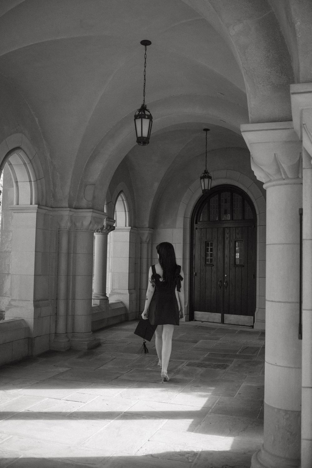 A sequence of black and white architectural photographs showing arched corridors with dramatic shadows and columns.