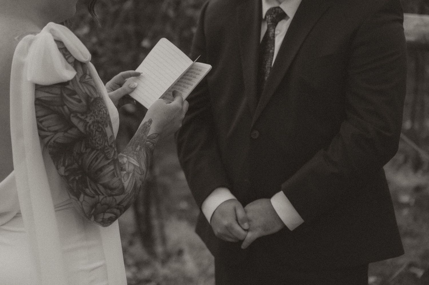 Indiana Wedding and Elopement Photographer // Black and white photo of vow close up while a bride reads her vows