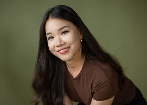 Portrait series against an olive green background featuring warm smiles and casual brown attire.