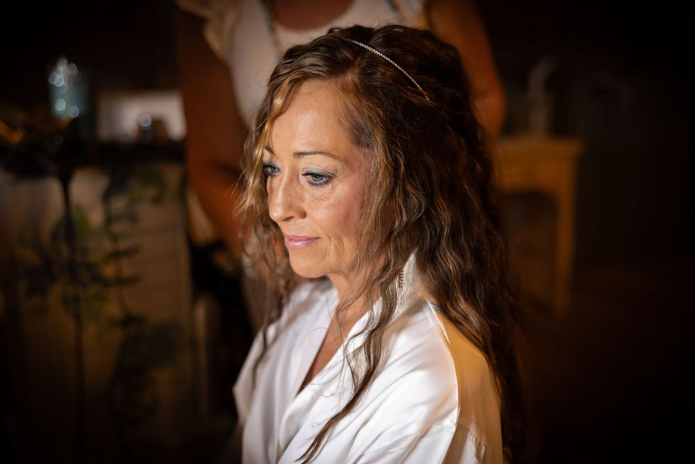 Atmospheric getting ready photos in warm lighting showing wedding preparation moments.