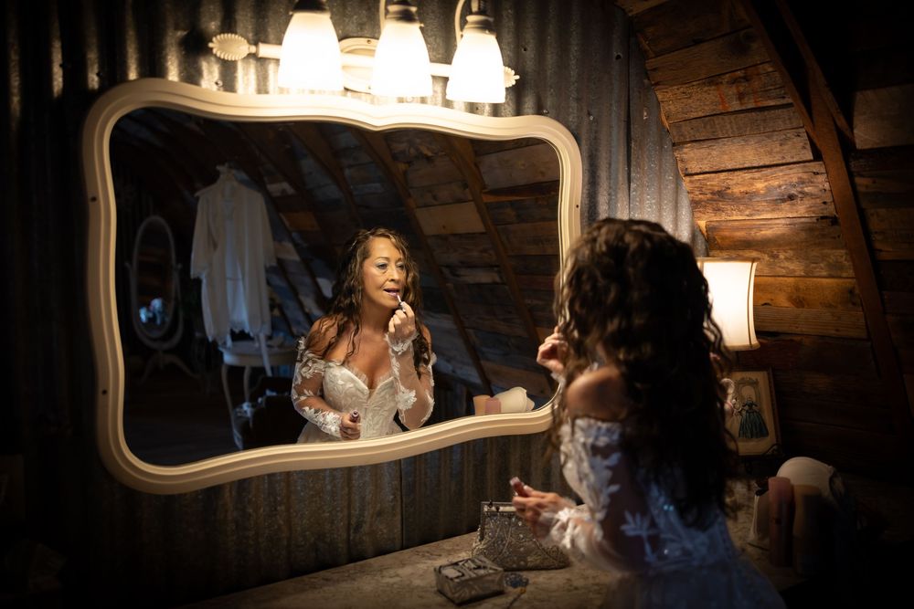 Moody mirror reflections in a rustic wooden room with ambient lighting.
