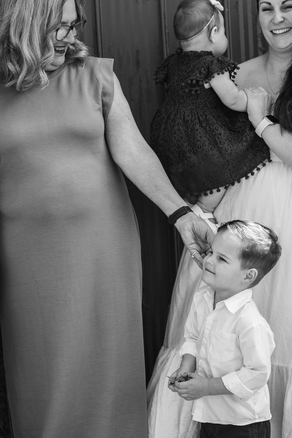 A series of candid getting-ready moments captured during wedding preparations in black and white.